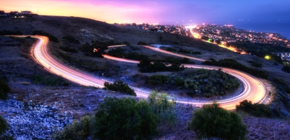 Hill-side night view with city in background