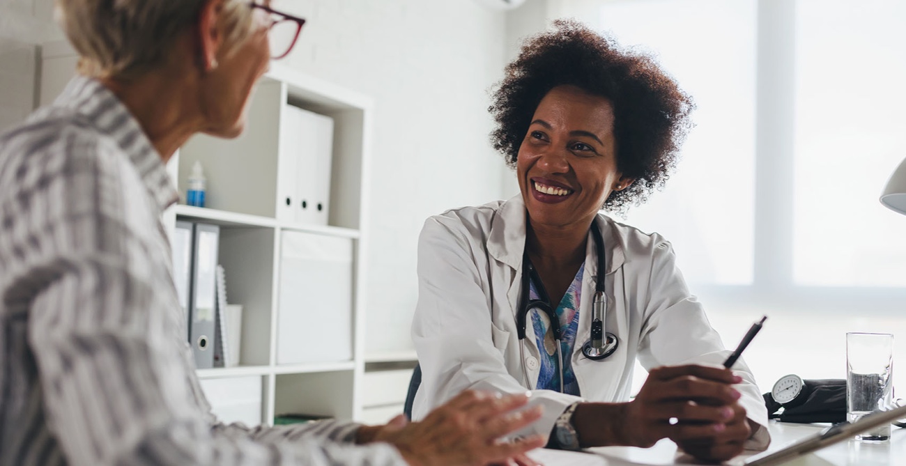 Two women from healthcare talking to each other