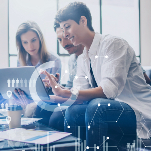 Three people discussing work in office