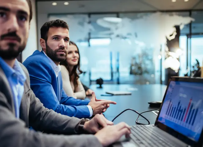 People looking at the presenter during a meeting