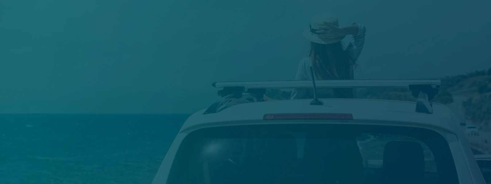 Woman see the horizon from car's sunroof.