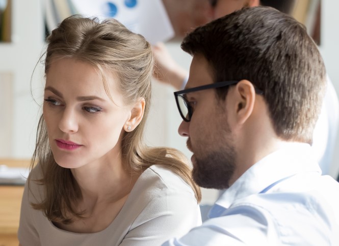 A man and a woman in discussing work